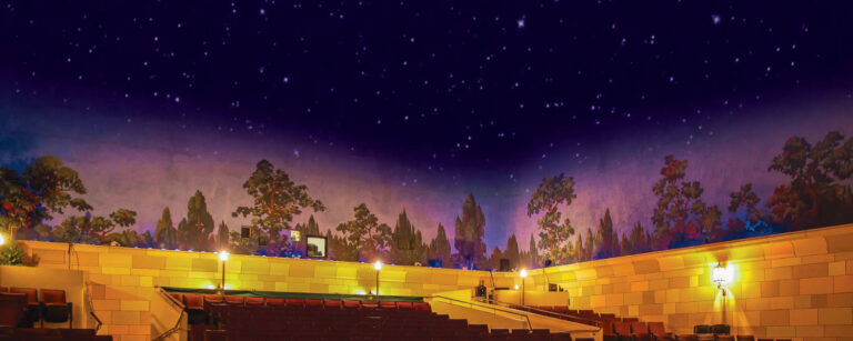 Background image showing the Capitol Theatre's atmospheric theatre ceiling and part of the auditorium.